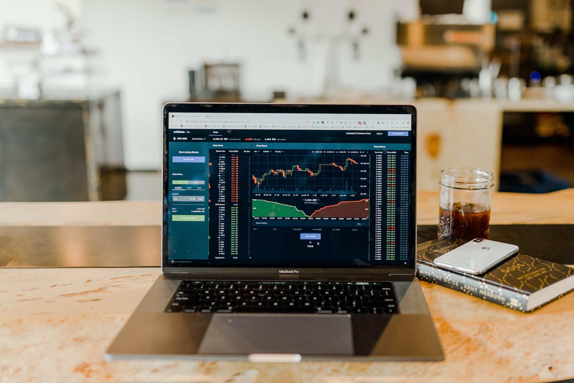 Laptop On Table Showing Stock Trading